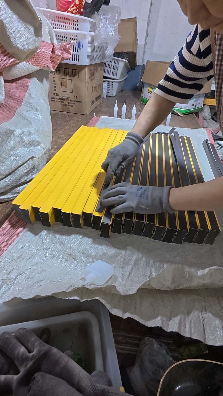Magnetic strip being fitted to a spirit level base